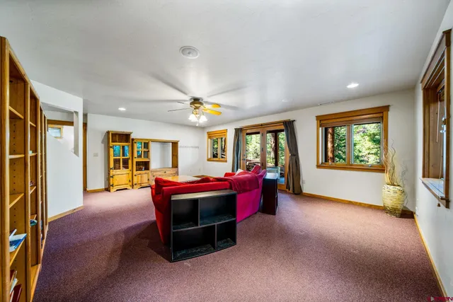 a swimming pool with outdoor seating and yard