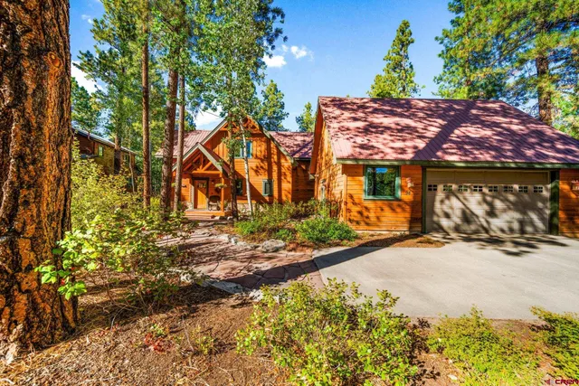a view of a house with a tree