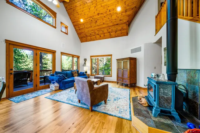a living room with furniture fireplace and flat screen tv