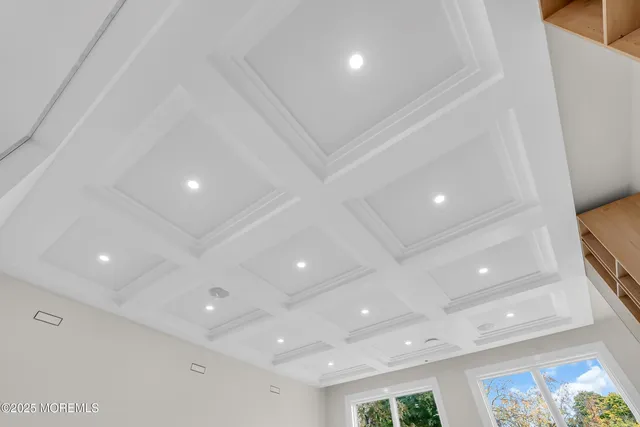 a view of entryway with a window and chandelier