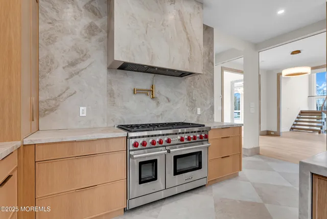 a kitchen with a stove and a sink