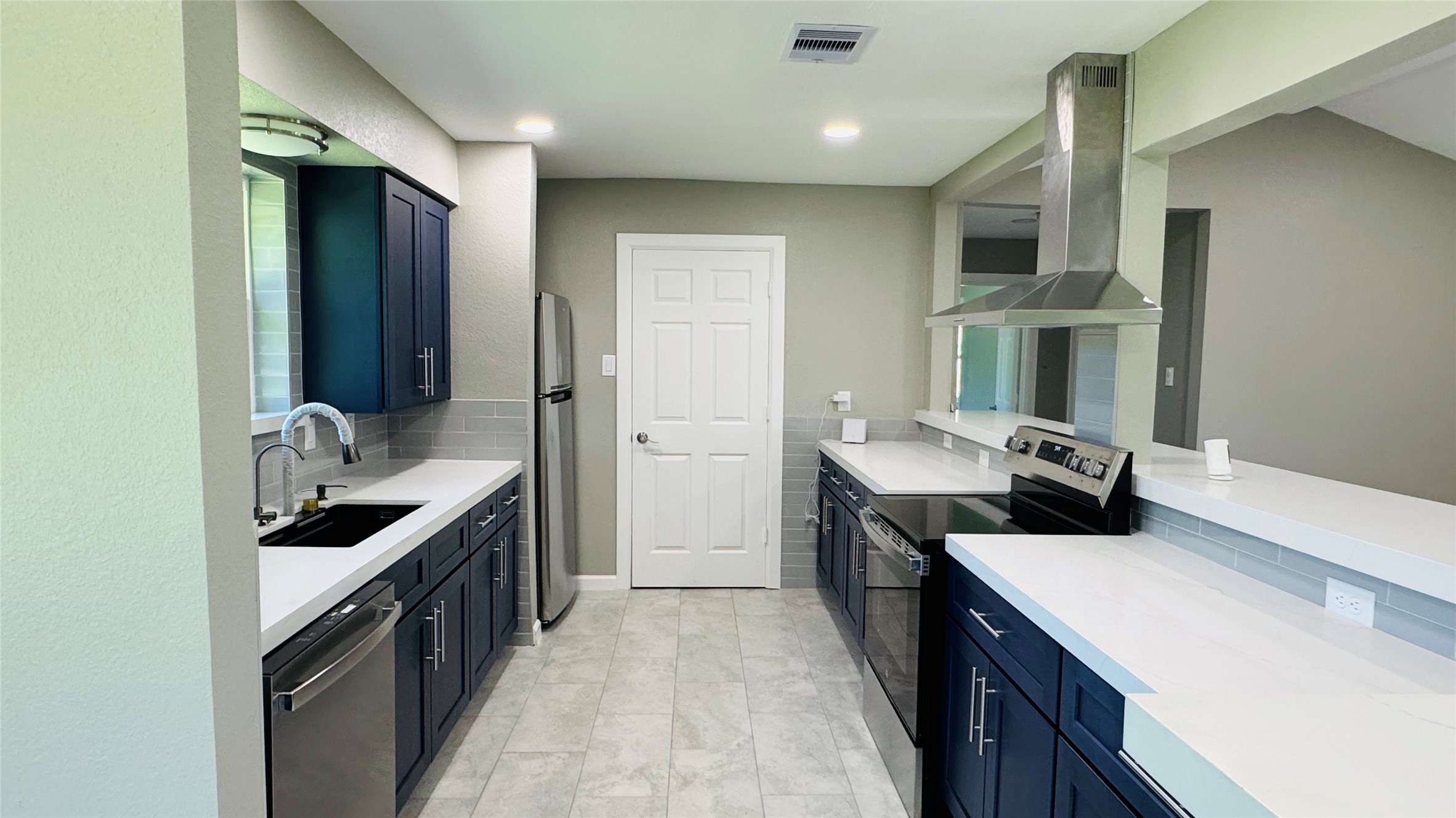 1434 County Road 878A Sweeny, TX 77480 - Photo 12 of 36 a kitchen with a sink stove top oven and cabinets