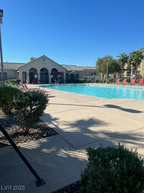 Community pool with a patio area
