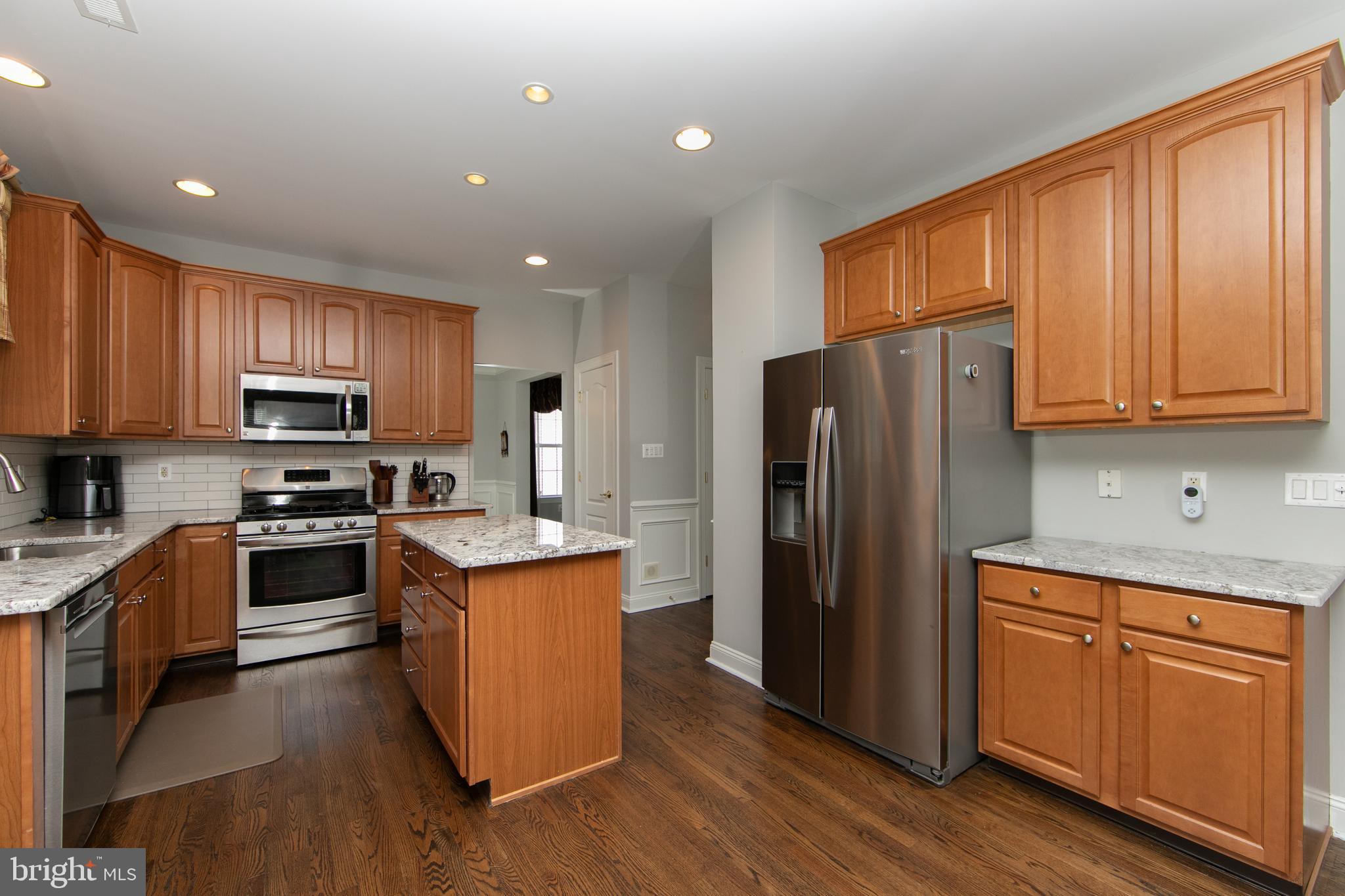 7 Kyle Court Mount Laurel, NJ 08054 - Photo 22 of 67 a kitchen with stainless steel appliances granite countertop a refrigerator stove microwave and sink