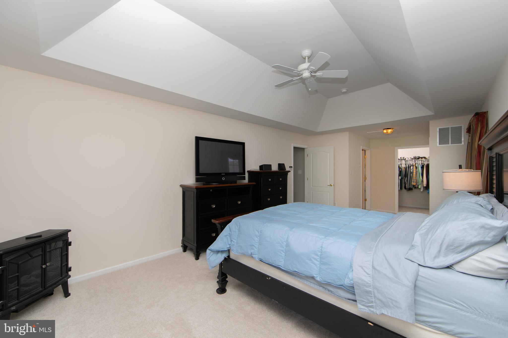 7 Kyle Court Mount Laurel, NJ 08054 - Photo 36 of 67 a bedroom with a bed and a flat tv screen on dresser