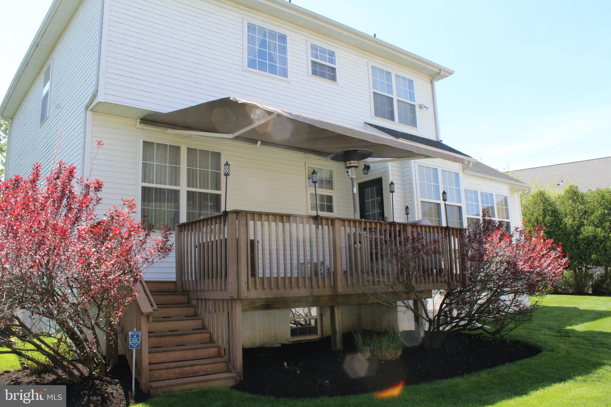 7 Kyle Court Mount Laurel, NJ 08054 - Photo 4 of 67 a front view of a house with a yard
