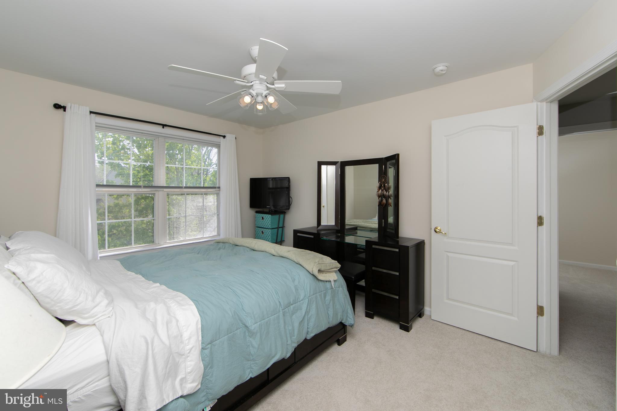 7 Kyle Court Mount Laurel, NJ 08054 - Photo 42 of 67 a bedroom with a bed and a large window
