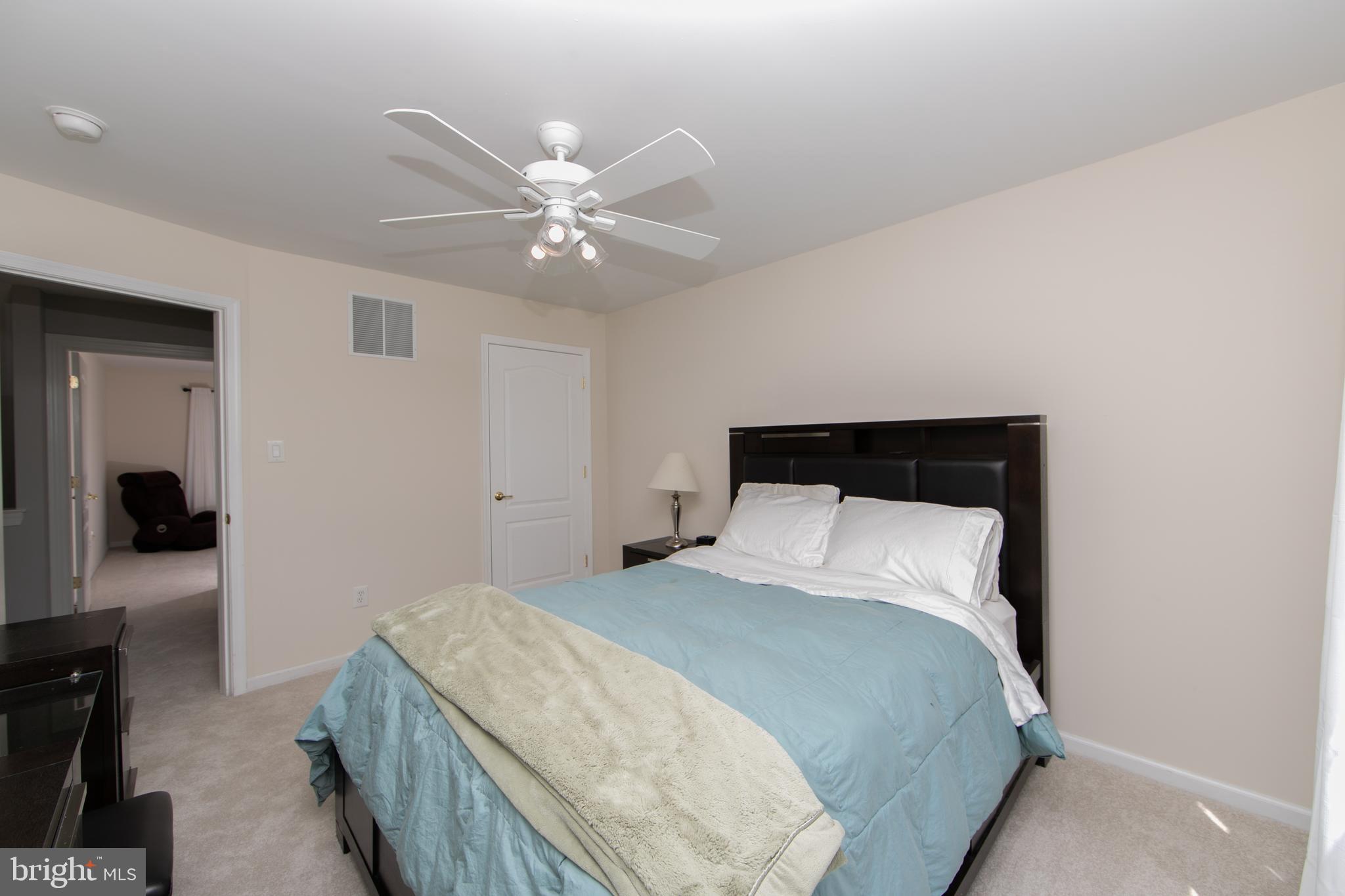 7 Kyle Court Mount Laurel, NJ 08054 - Photo 43 of 67 a bedroom with a bed and a chandelier