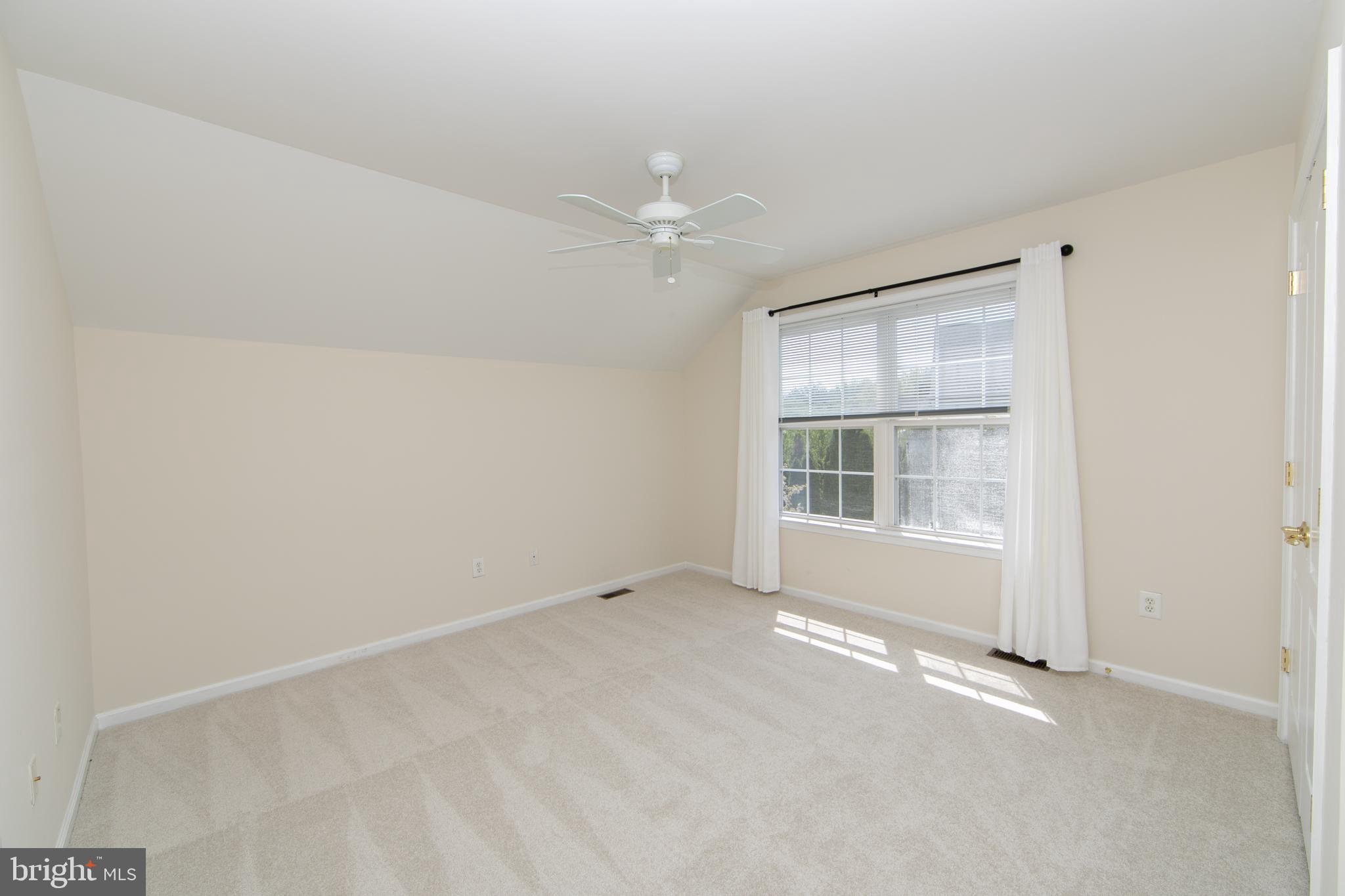 7 Kyle Court Mount Laurel, NJ 08054 - Photo 44 of 67 an empty room with chandelier fan and windows