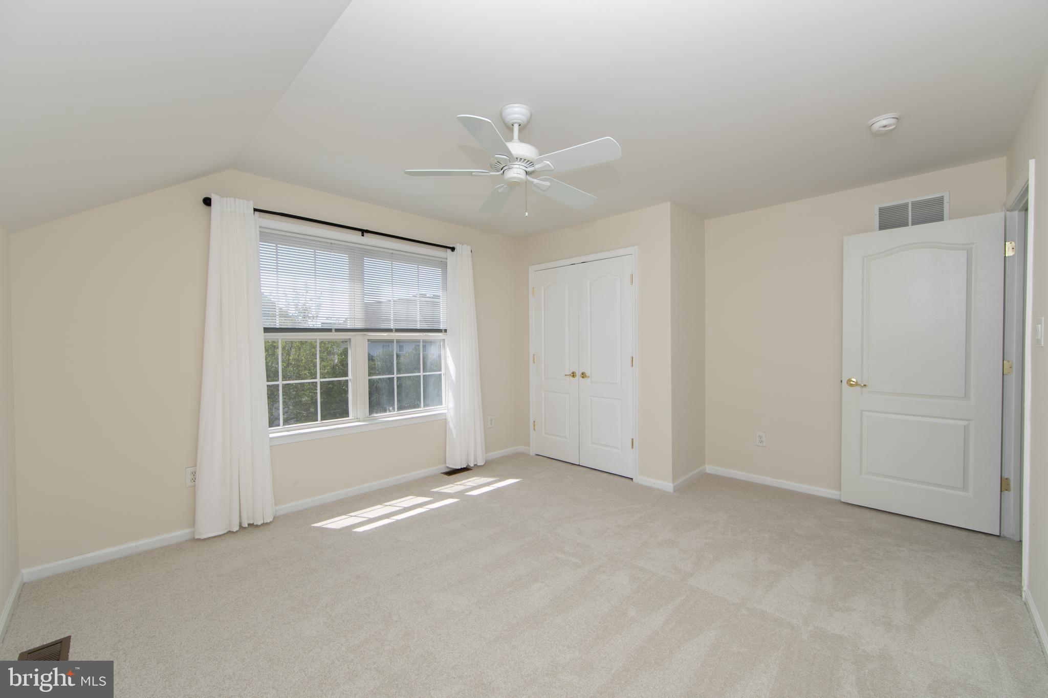 7 Kyle Court Mount Laurel, NJ 08054 - Photo 45 of 67 an empty room with chandelier fan and windows