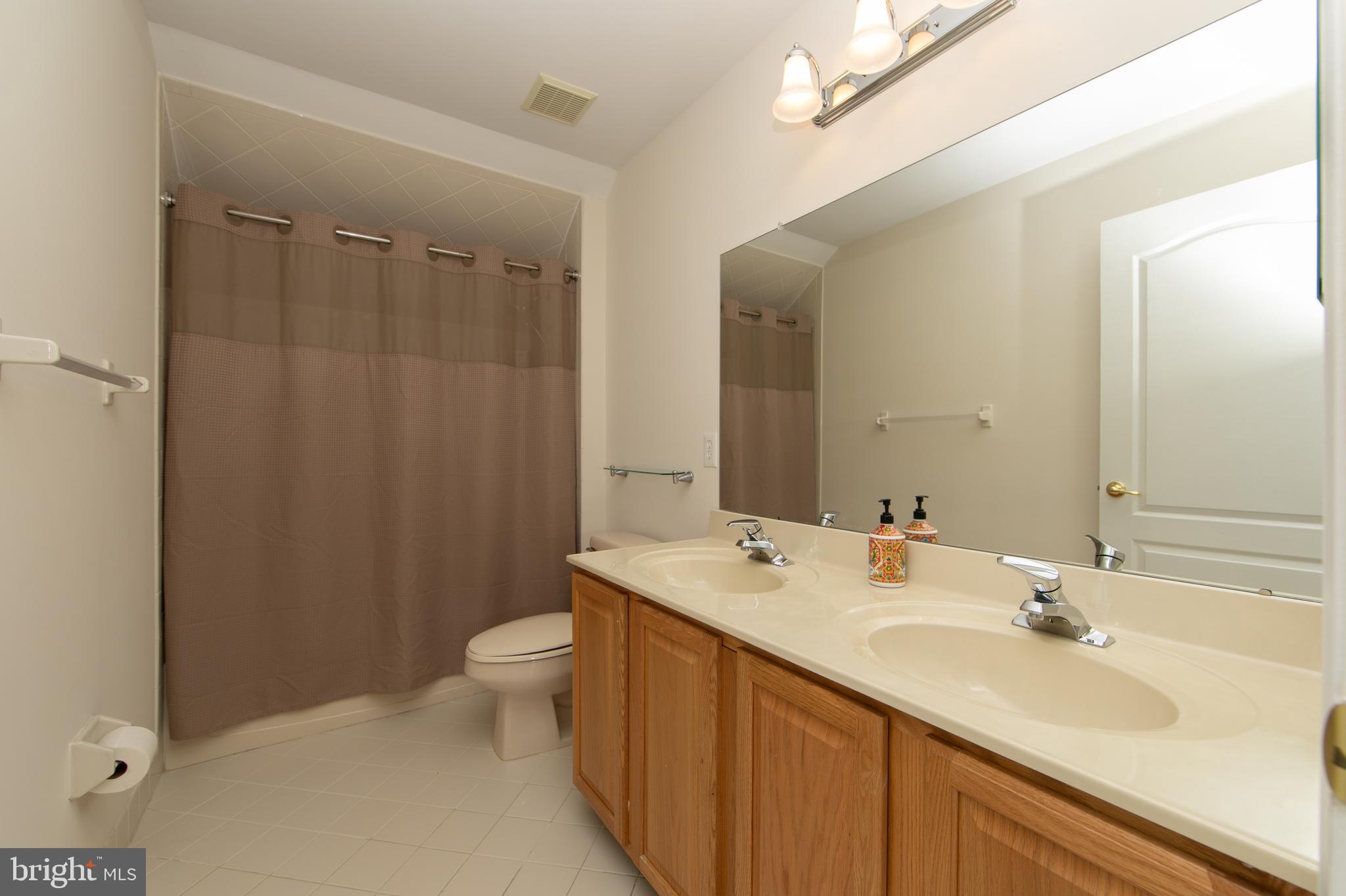7 Kyle Court Mount Laurel, NJ 08054 - Photo 50 of 67 a bathroom with a sink a toilet a shower and a mirror