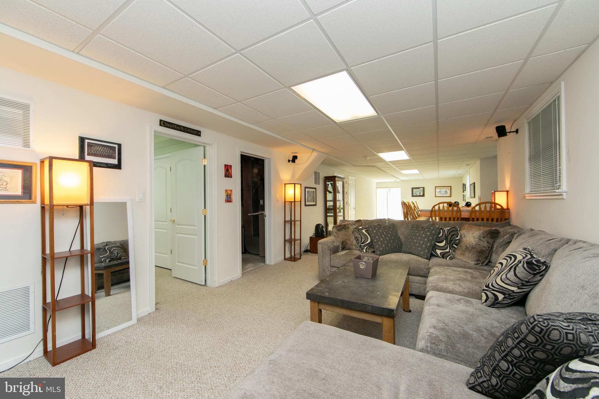 7 Kyle Court Mount Laurel, NJ 08054 - Photo 53 of 67 a living room with furniture a large window and stainless steel appliances