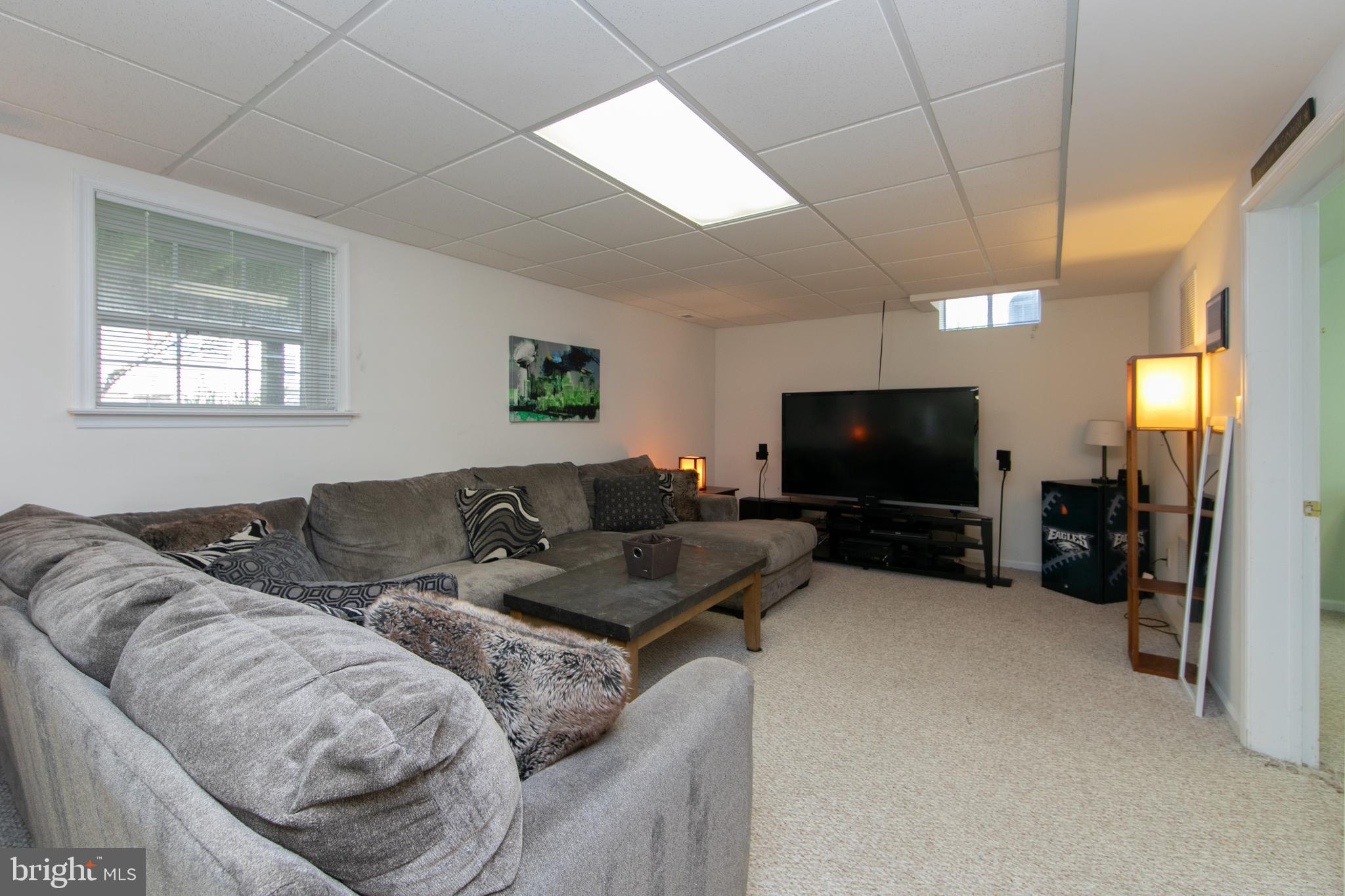 7 Kyle Court Mount Laurel, NJ 08054 - Photo 58 of 67 a living room with furniture and a flat screen tv