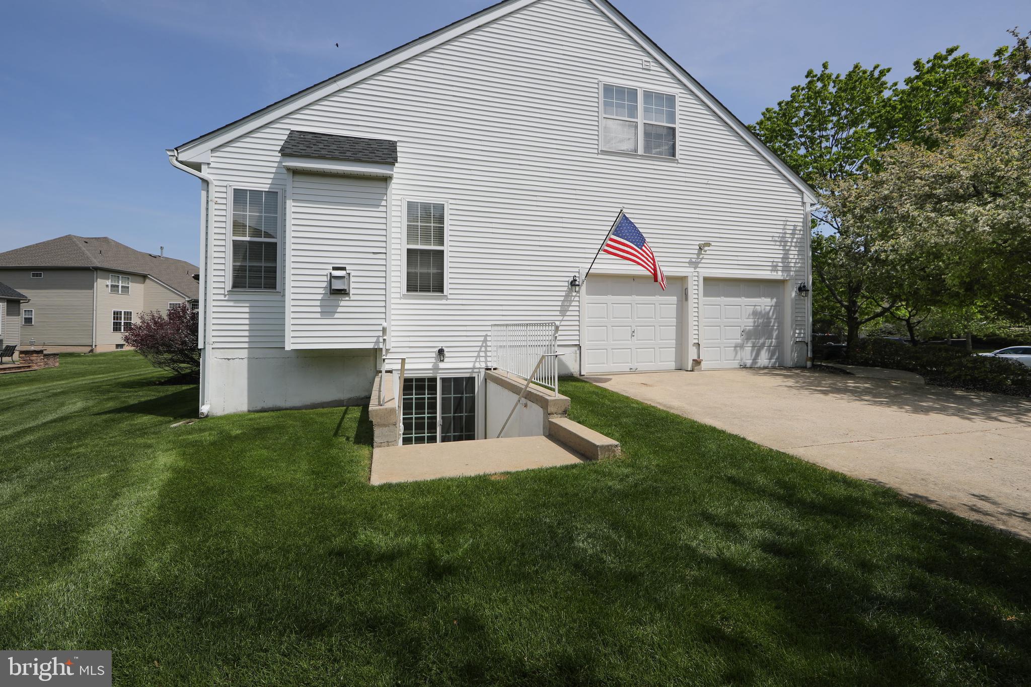 7 Kyle Court Mount Laurel, NJ 08054 - Photo 10 of 67 a view of a white house with a yard and potted plants