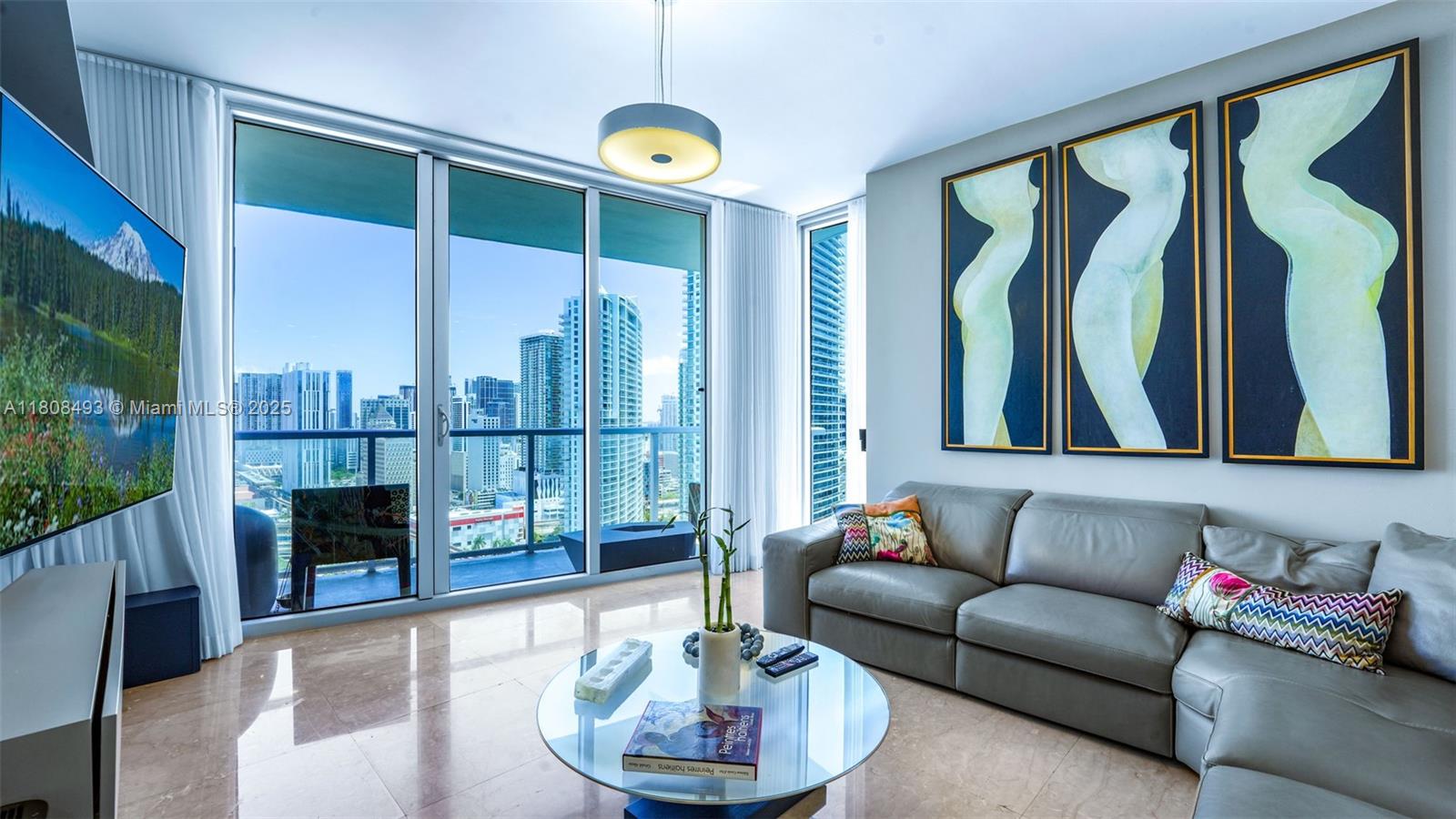 185 Southwest 7th Street, Unit 2911 Miami, FL 33130 - Photo 2 of 33 a living room with furniture and a fireplace