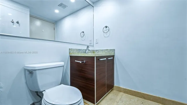 a bedroom with a bed and a cabinets