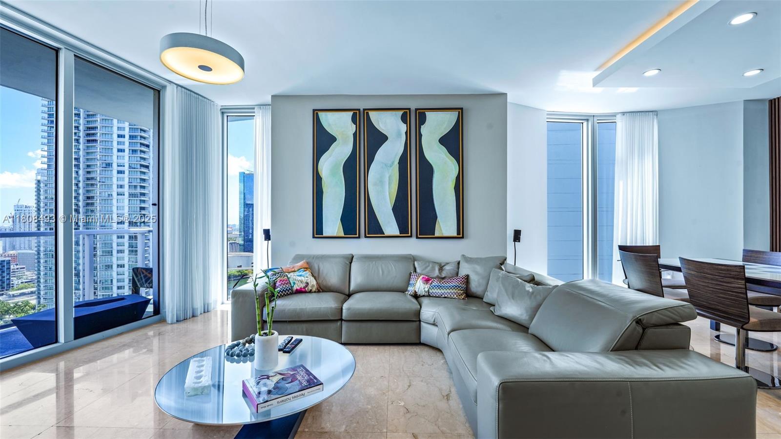 185 Southwest 7th Street, Unit 2911 Miami, FL 33130 - Photo 3 of 33 a living room with furniture and a large window