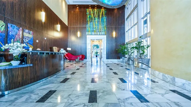 a view of a building with couches and pool