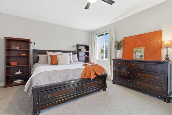 a bed room with a bed and a dresser