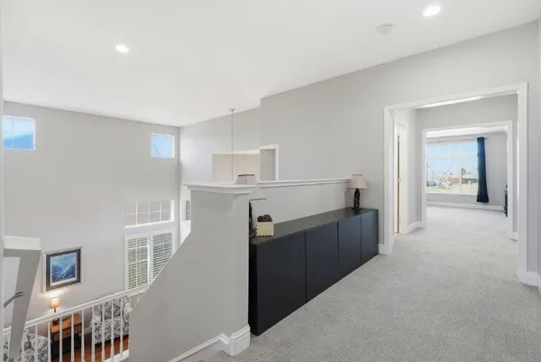 a kitchen with cabinets and wooden floor