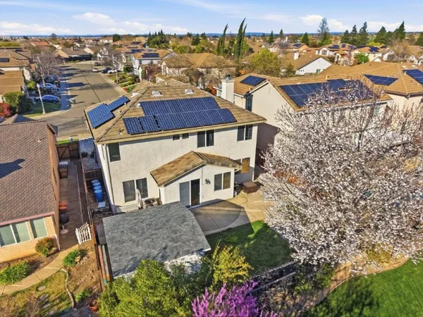 an aerial view of residential houses with outdoor space