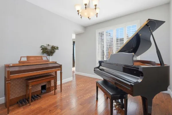 a view of a livingroom with furniture and staircase