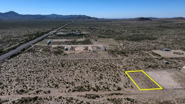 a view of a dry yard with mountain