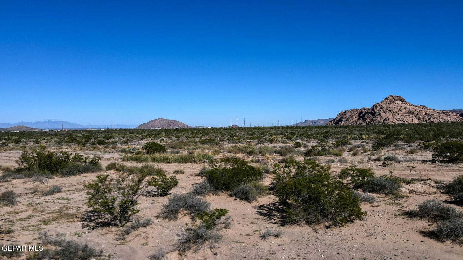 14 Rainbow Garden El Paso, TX 79927 - Photo 2 of 16 a view of a large building with a mountain in the background