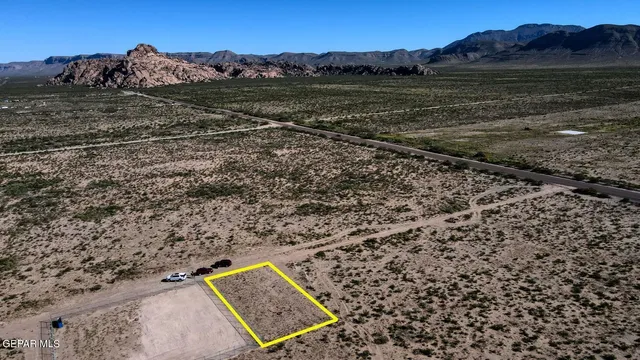 a view of a yard with a mountain