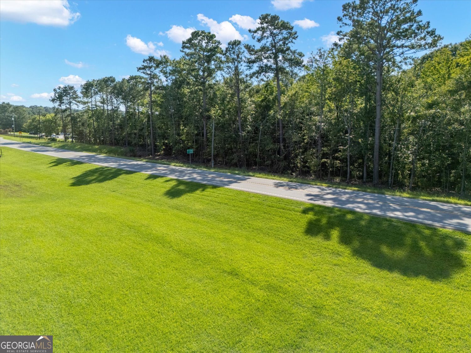 6710 Washington Road Appling, GA 30802 - Photo 3 of 7 a view of a swimming pool with a yard
