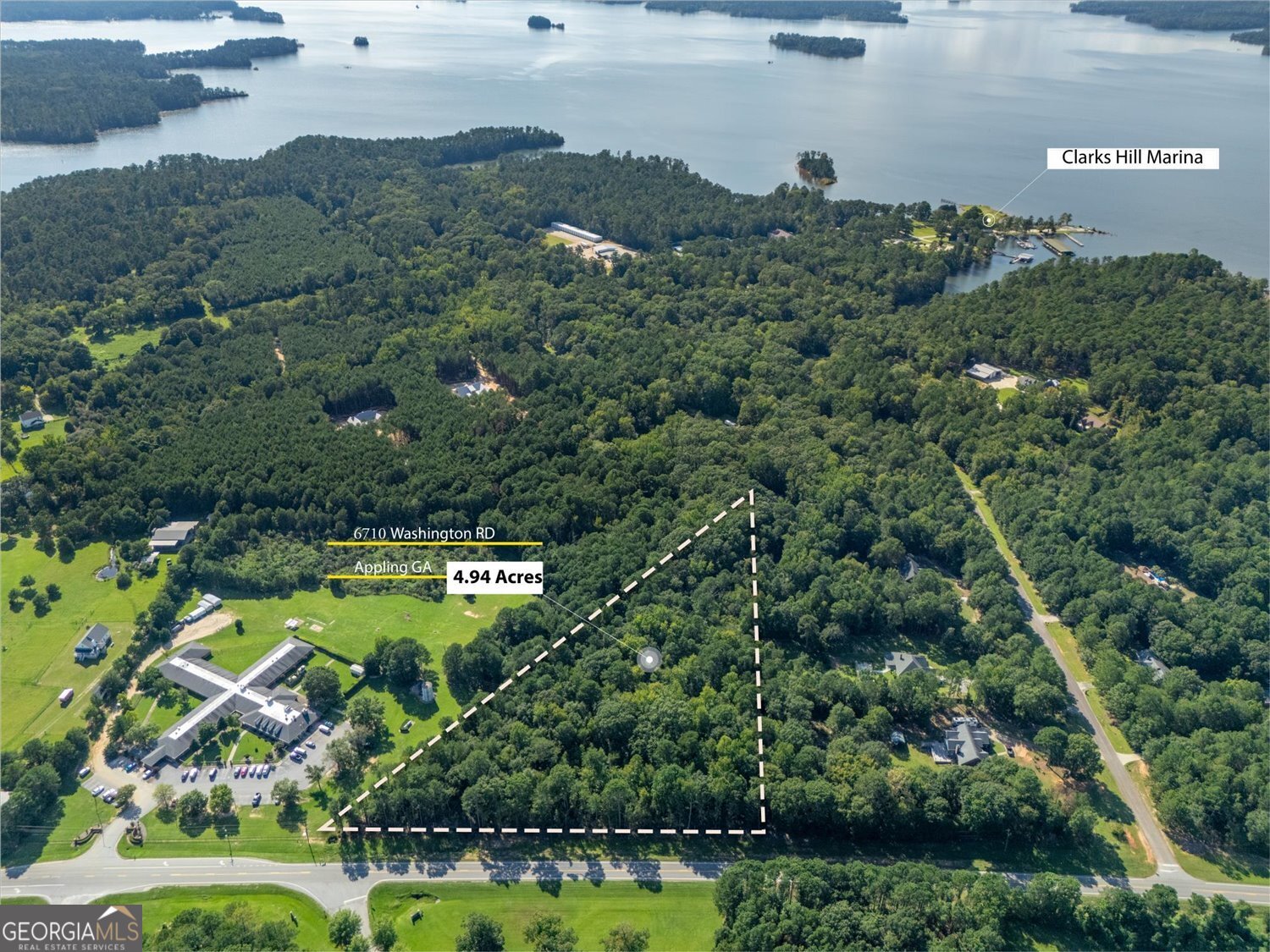6710 Washington Road Appling, GA 30802 - Photo 6 of 7 an aerial view of a house with a garden and lake view