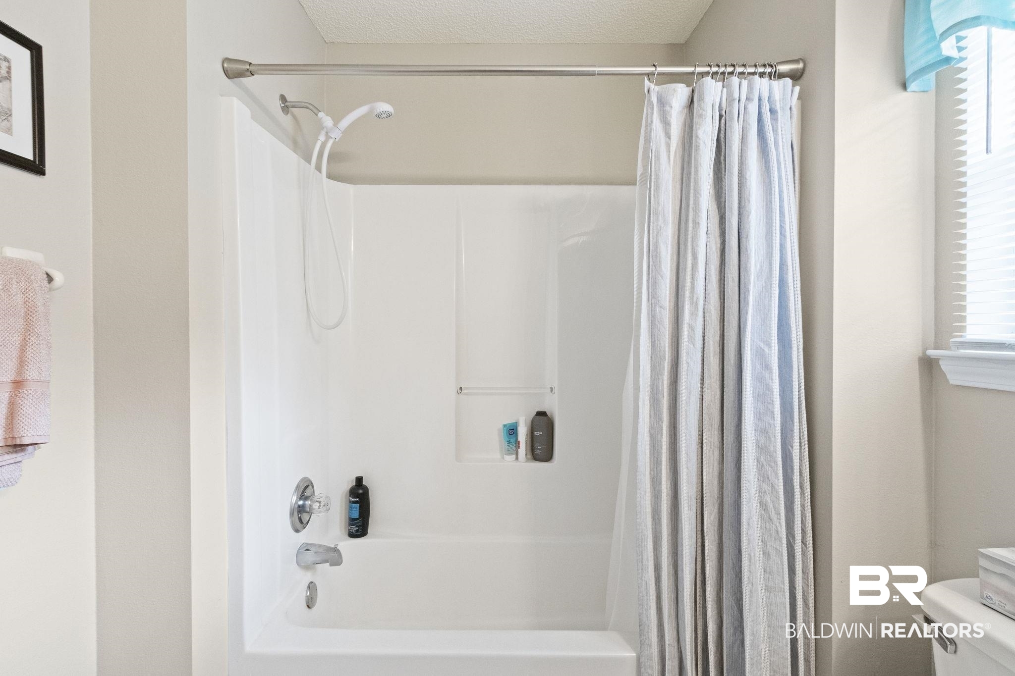 14031 Brook Hollow Road Summerdale, AL 36580 - Photo 40 of 56 Bathroom featuring a textured ceiling, toilet, and shower / bathtub combination with curtain