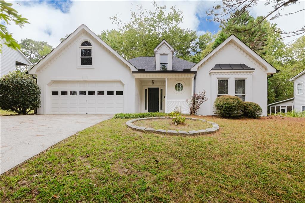 a front view of a house with garden