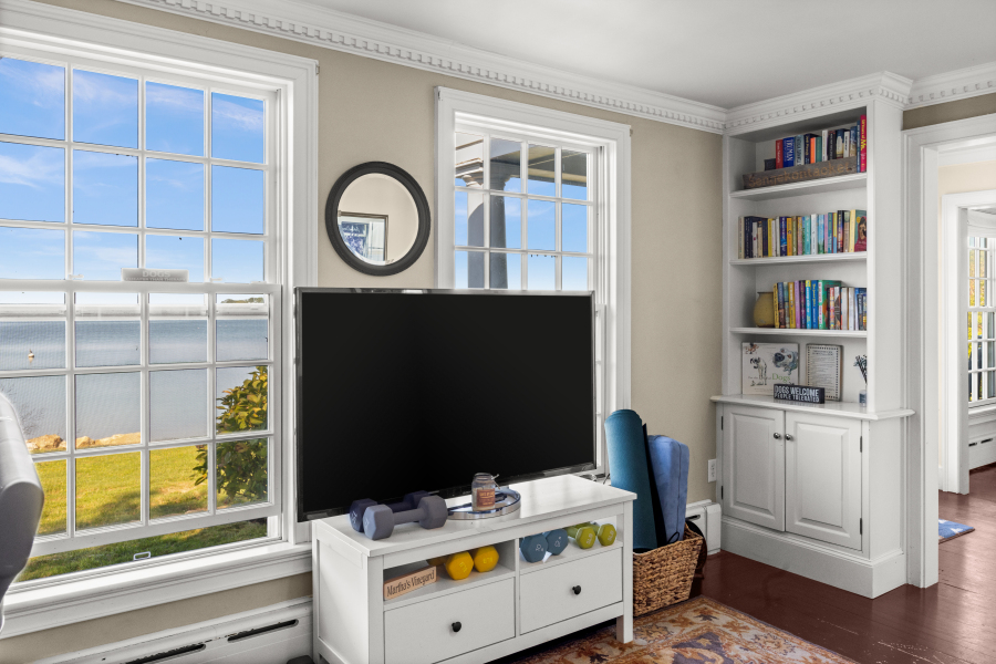 9 Fowler Avenue Edgartown, MA 02539 - Photo 12 of 27 a bedroom with a bed and a bookshelf