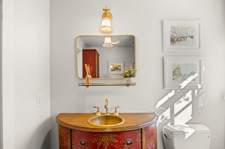 9 Fowler Avenue Edgartown, MA 02539 - Photo 14 of 27 a bathroom with a sink a mirror and a toilet