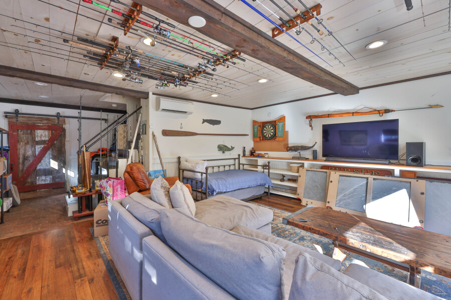9 Fowler Avenue Edgartown, MA 02539 - Photo 22 of 27 a living room with furniture and a flat screen tv