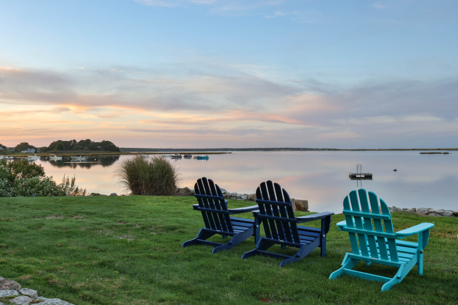 9 Fowler Avenue Edgartown, MA 02539 - Photo 24 of 27 a view of a lake in front of house with a yard