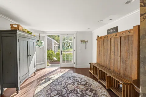a view of a hallway with windows and stairs