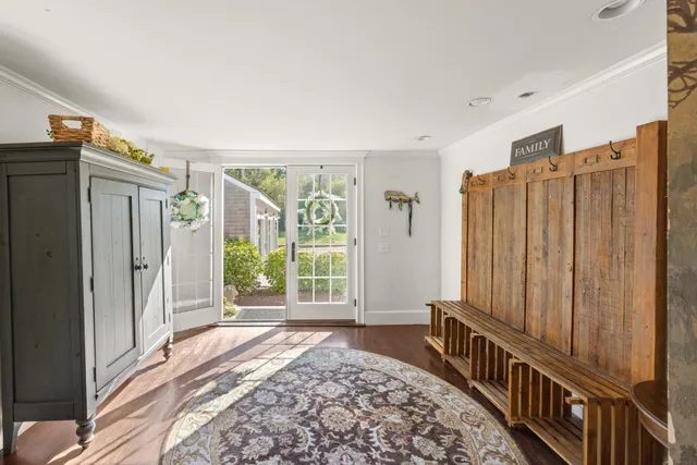 a view of a hallway with windows and stairs