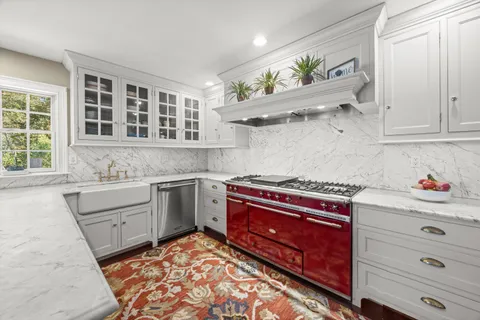 a kitchen with a stove and cabinets