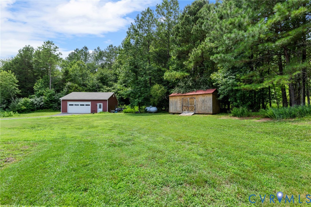 15220 River Road Chesterfield, VA 23838 - Photo 48 of 65 Expansive grassy lawn bordered by mature trees, fe