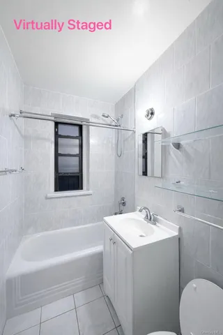 a buildings with car parked in front of it