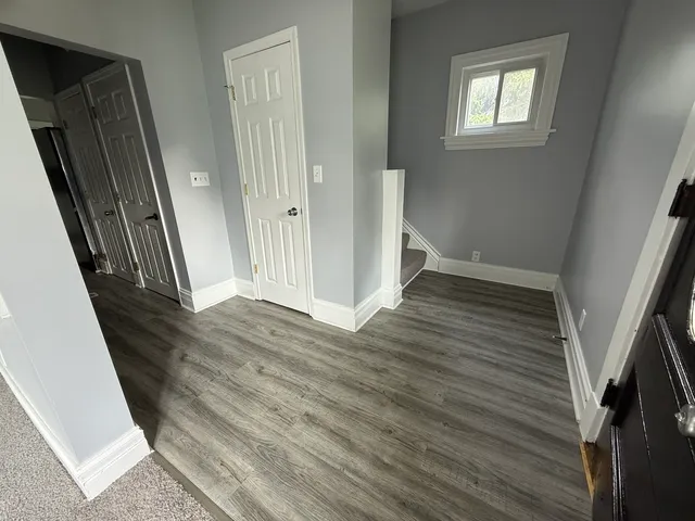 a view of a hallway view with staircase