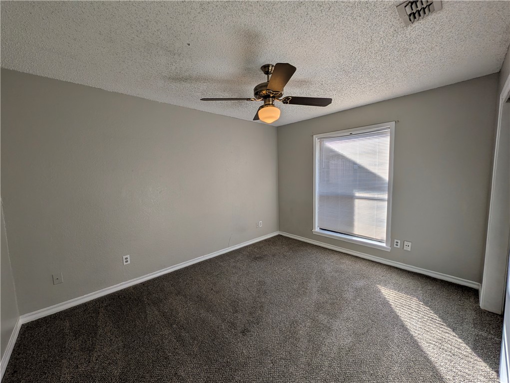 4621 Constance Street Corpus Christi, TX 78413 - Photo 15 of 19 a view of room with a ceiling fan and window