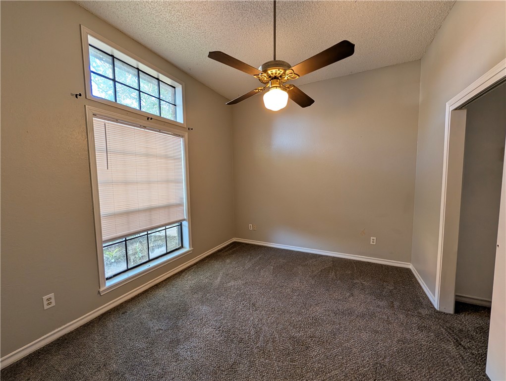 4621 Constance Street Corpus Christi, TX 78413 - Photo 16 of 19 an empty room with windows and fan