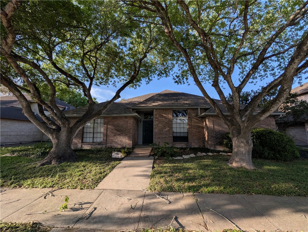 4621 Constance Street Corpus Christi, TX 78413 - Photo 2 of 19 a front view of a house with garden