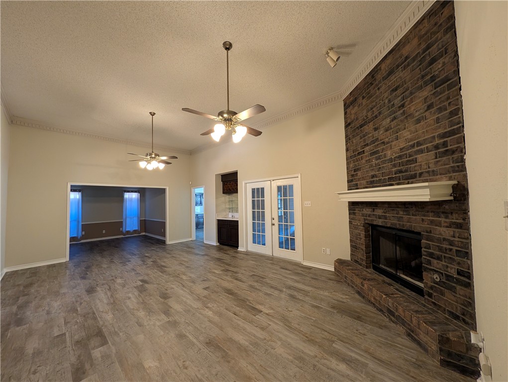 4621 Constance Street Corpus Christi, TX 78413 - Photo 3 of 19 a view of a livingroom with a fireplace and chandelier fan