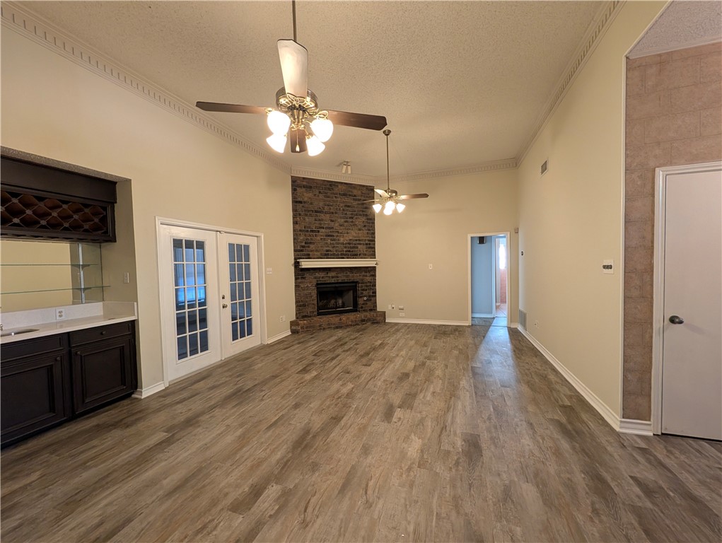 4621 Constance Street Corpus Christi, TX 78413 - Photo 4 of 19 a view of an empty room with a kitchen and a window