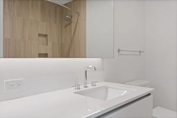 a bathroom with a sink and mirror