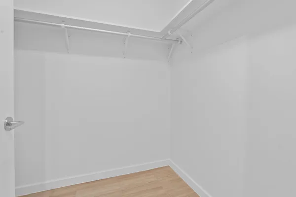 a view of an empty walk in closet